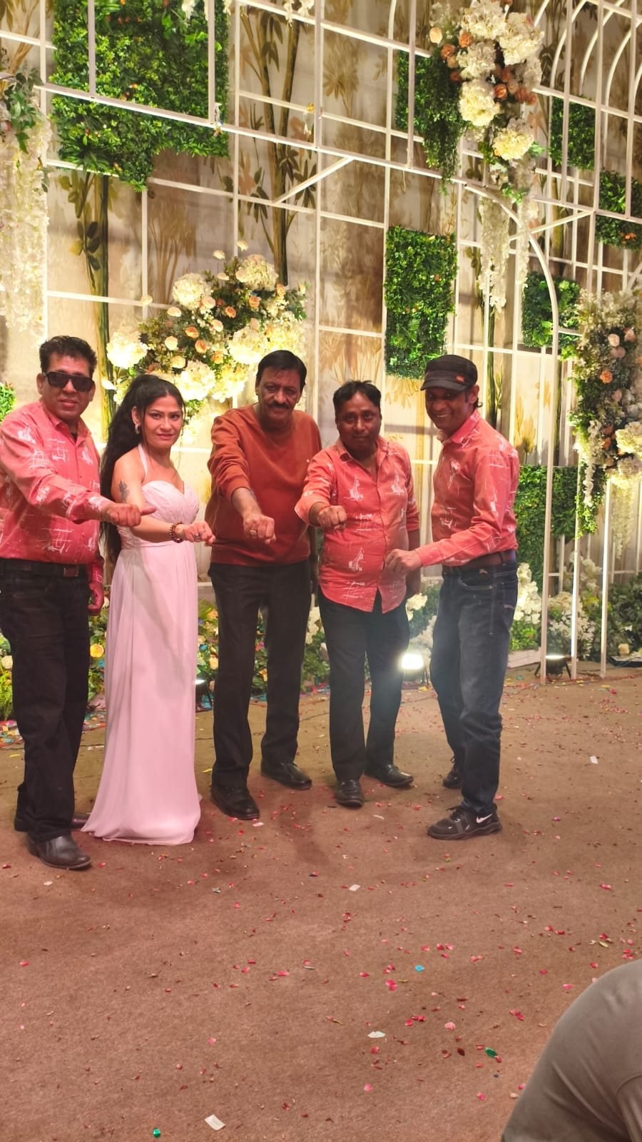 Star Musical Entertainer performers and musicians together on a floral wedding stage